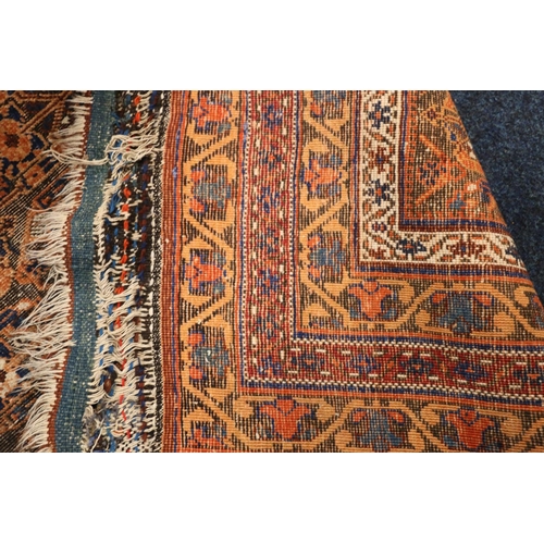 550 - Eastern rug, the field with seven rows of gul, multiple guards, fringed ends, 183cm x 120cm.