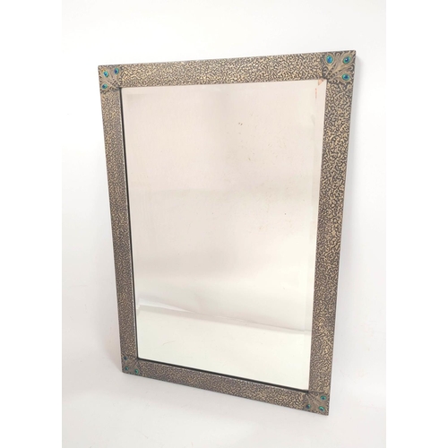 232 - Art Nouveau style rectangular wall mirror. The frame with hammered textured finish and peacock feath... 