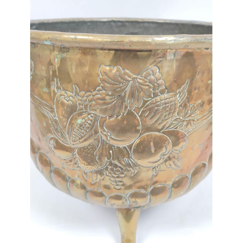 364 - 19th century brass jardiniere with repousee fruit decoration, lion mask handles and raised on claw s... 