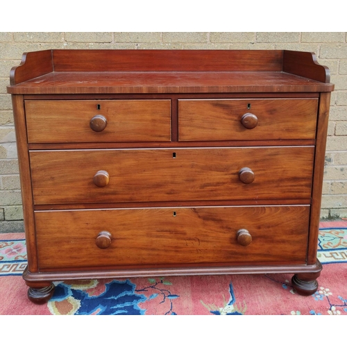 424 - Victorian mahogany two over two chest of drawers with galleried top, turned handles and  bun feet. 9... 