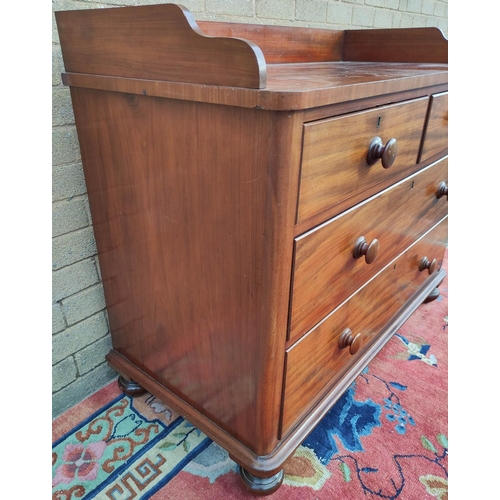 424 - Victorian mahogany two over two chest of drawers with galleried top, turned handles and  bun feet. 9... 