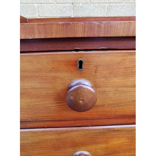 424 - Victorian mahogany two over two chest of drawers with galleried top, turned handles and  bun feet. 9... 