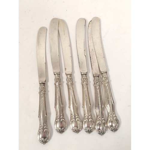 127 - Two sets of six silver handled butter knives, a Victorian engraved e.p. three piece tea set, a kettl... 