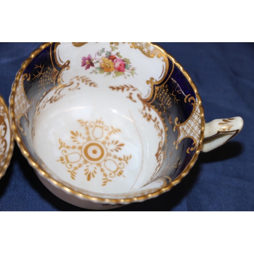 448 - Harlequin set of Coalport English porcelain cobalt blue gilt and hand-painted floral batwing pattern... 