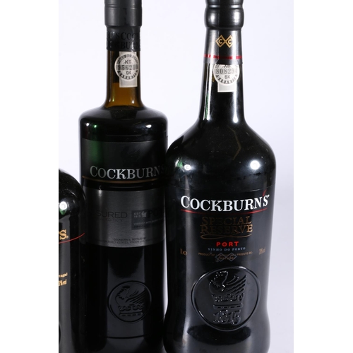 309 - Four bottles of COCKBURN's port including three Special Reserve 20% abv. 2x 75cl 1x 1litre, one boxe... 