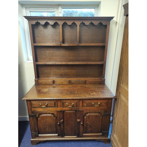 434 - Georgian style oak country dresser with plate rack, above three short drawers and two panel doors. R... 