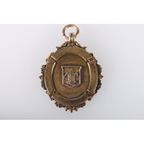 694 - 9ct gold shield shaped medal fob, the obverse with shield shaped cartouche with fleur de lis, the re... 