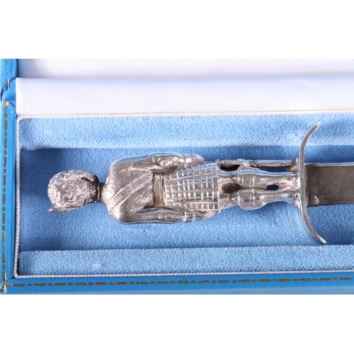 798 - Contemporary silver paperknife, the handle modelled as a Highlander in full Scottish Highland dress ... 