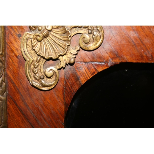 508 - French walnut two door cabinet, the serpentine edged marble top above two glazed panel doors, ormolu... 