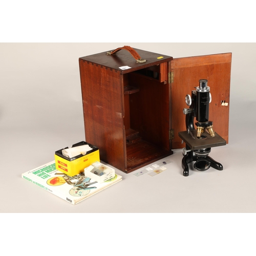 221 - Boxed microscope and accessories, 