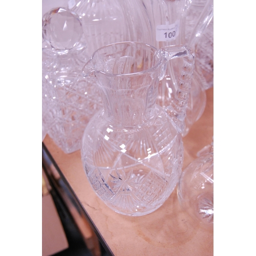 100 - Group of cut glass and crystal to include mallet-shaped and other decanters and stoppers, etched gla... 