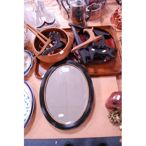 106 - Wood items to include a decorative mahogany tray stand, oak tray, salad bowl and servers, plate stan... 