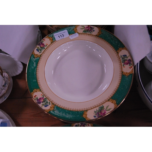 113 - Booth's dinner set with green and gilt floral decoration.