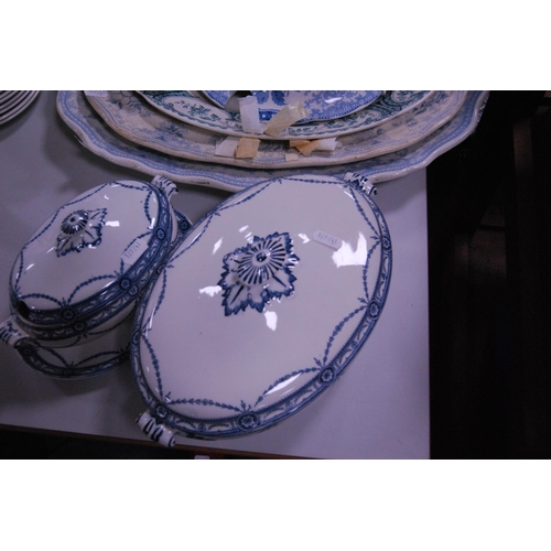 118 - Group of Victorian and later dinnerwares to include ashets, tureen cover, tureen and sauce tureen on... 