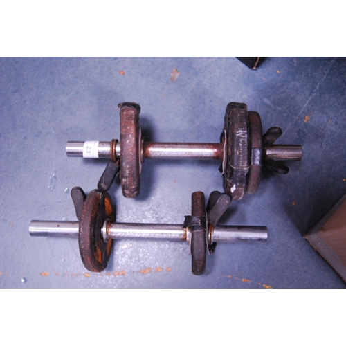 23 - Pair of dumbbell weights.
