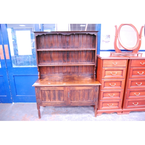 366 - Oak dresser, label to the interior for Wolfe & Hollander, Tottenham Court Road, London.