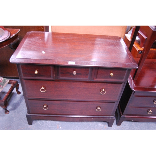 379 - Stag Minstrel chest of drawers, bedside table and a bedside chest.  (3)