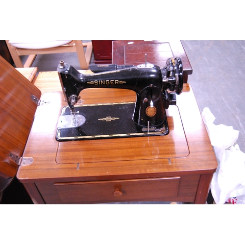 383 - Singer table sewing machine with accessories.