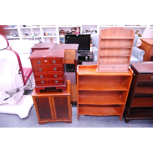 389 - Open bookcase, wall shelf, small reproduction four-drawer chest and a media unit.  (4)