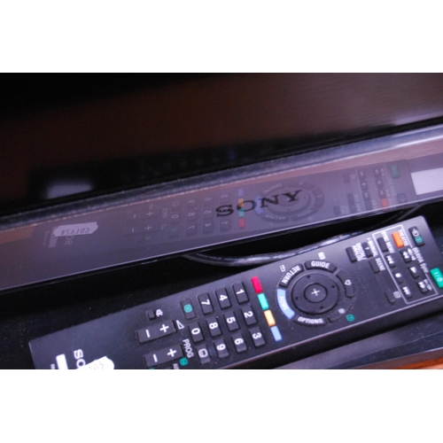 405 - Sony Bravia television with remote control.