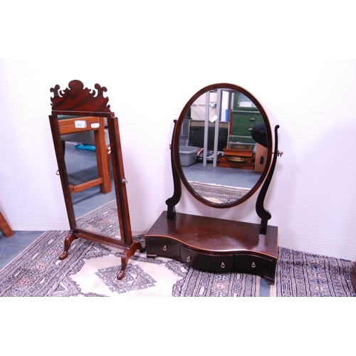 413 - Fretwork mahogany dressing mirror and a mahogany swing oval dressing mirror on serpentine drawer bas... 