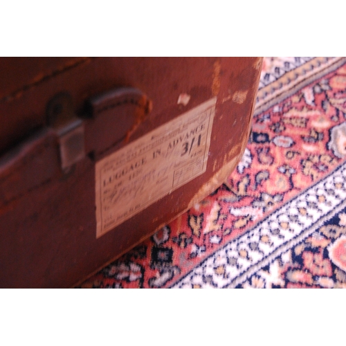 420 - Wood-bound travel trunk and a woven laundry basket.  (2)