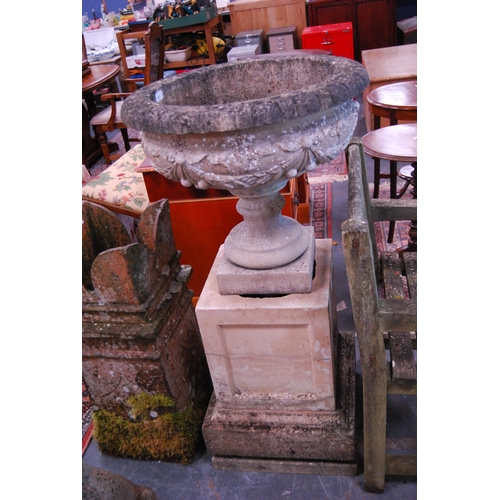 423 - Stoneware campagna urn on a composite cubed and plinth base.