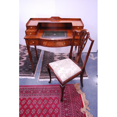 436 - Reproduction mahogany lady's escritoire with tooled inset and a similar chair.  (2)