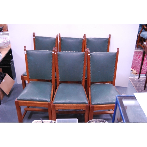 438 - Set of six oak-framed dining chairs with stuff-over studded upholstery.  (6)