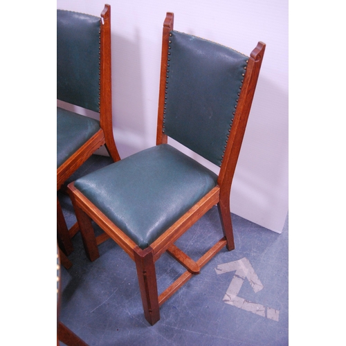 438 - Set of six oak-framed dining chairs with stuff-over studded upholstery.  (6)