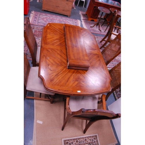 442 - Continental-style oak-effect dining table with two additional leaves, and a set of six Continental-s... 