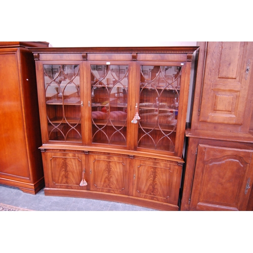 450 - Bevan-Funnell Reprodux mahogany concave display cabinet on cupboard base, stamped 503 to the inside.