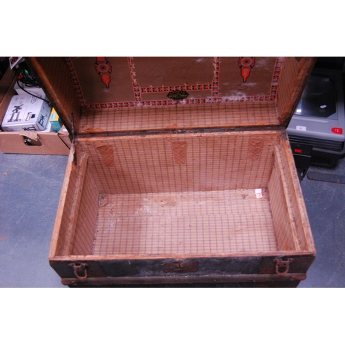 453 - Wood-bound and metal domed travel trunk.