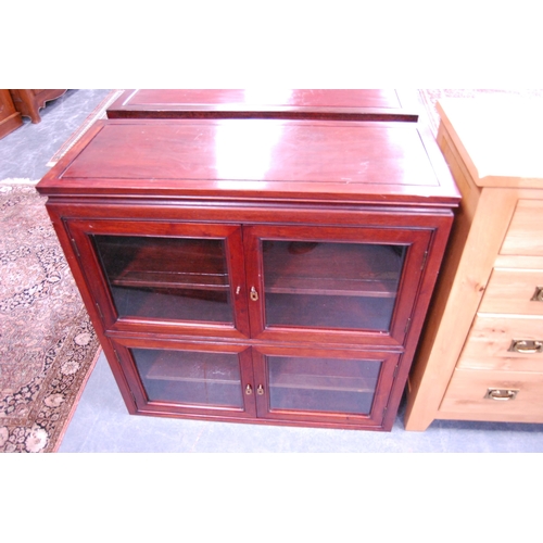 455 - Chinese-style hardwood glazed cabinet enclosing shelves.