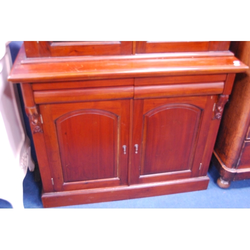 470 - Victorian-style mahogany two-door bookcase top on chiffonier base.