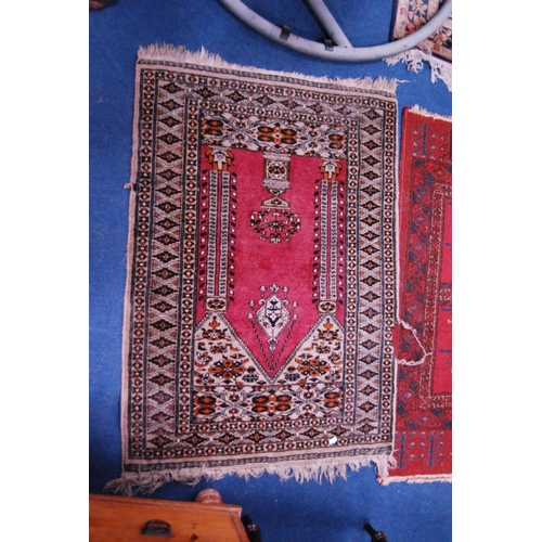 475 - Turkish/Afghan hand-knotted rug on red ground and another Turkish-style rug.  (2)