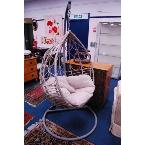 476 - Modern garden wicker-effect egg chair on stand.