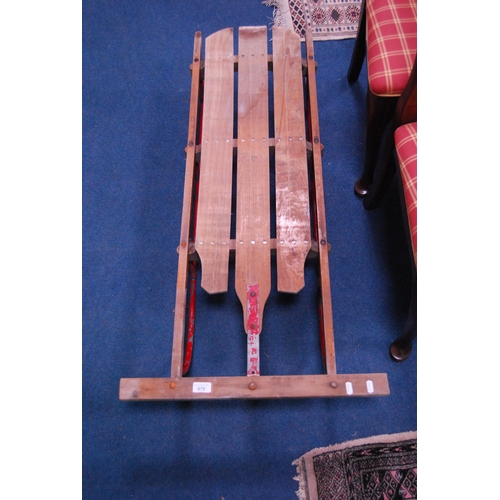 479 - Vintage child's wood and painted metal sledge.