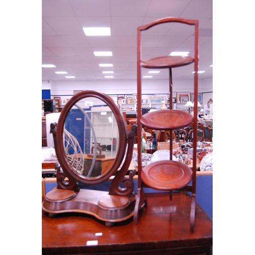 484 - Victorian mahogany dressing mirror and a folding cake stand.  (2)