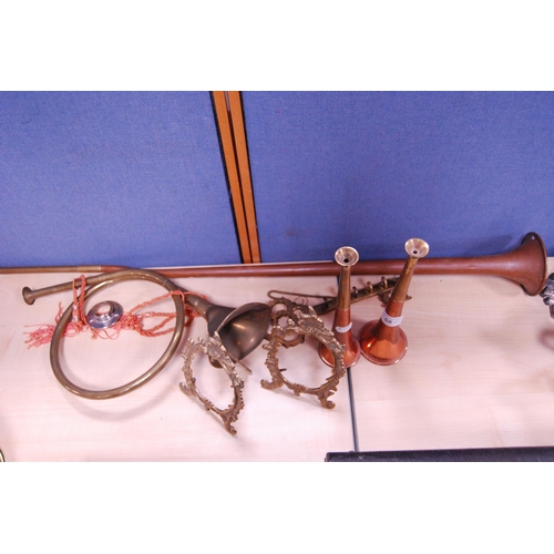 58 - Copper and brass to include a hunting horn, smaller hunting horns, pair of ornate picture frames, ho... 