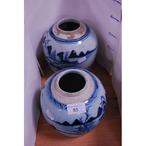 85 - Two graduated Chinese Ming Revival antique blue and white ginger jars (lacking covers).  (2)