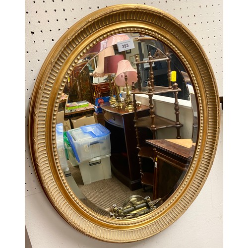 393 - Gilt framed oval mirror 60cm x 50cm