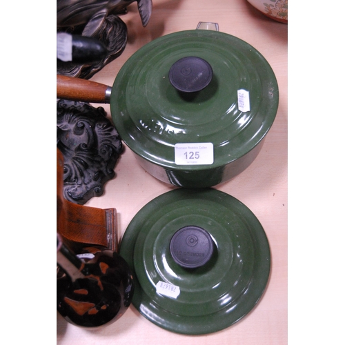 125 - Le Creuset green glazed saucepan and cover and another saucepan lid.