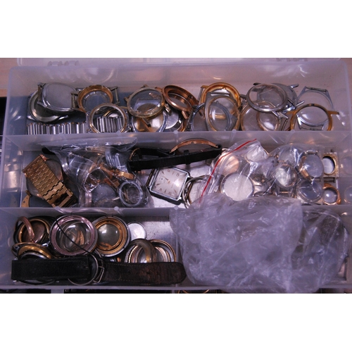 130 - Trays containing automatic and manual wind watch accessories to include dials, cases, and movements ... 