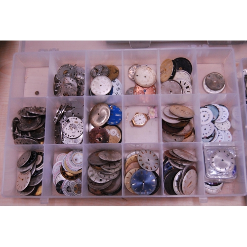 130 - Trays containing automatic and manual wind watch accessories to include dials, cases, and movements ... 