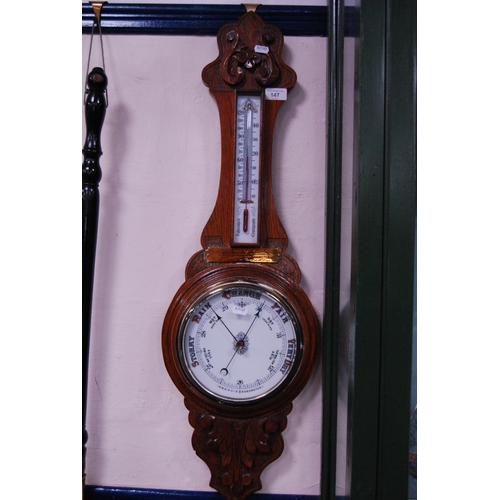 147 - Early 20th century oak banjo aneroid barometer with presentation plaque.