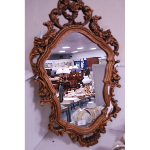 167 - Ornate gilt framed mirror.