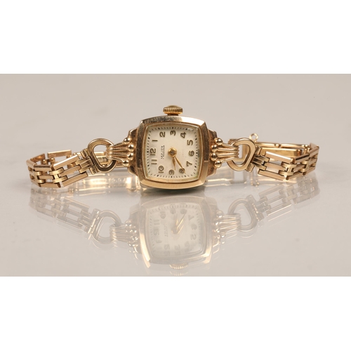 66 - 9ct gold cased Majex ladies wrist watch on a 9 ct gold strap.total weight 14 grams