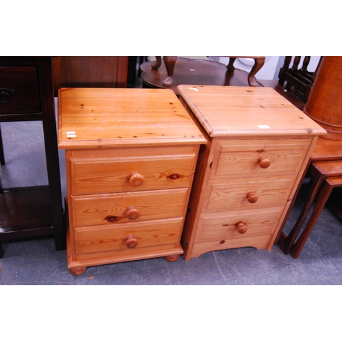 386 - Two modern pine three-drawer bedside chests.