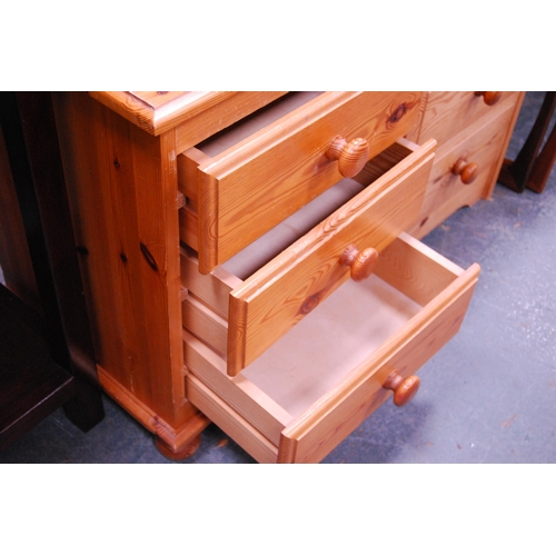 386 - Two modern pine three-drawer bedside chests.